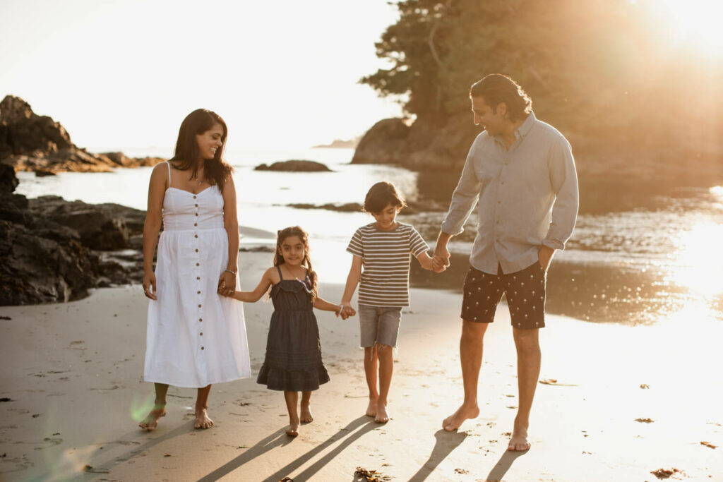 family walking down mackenzie beach in tofino