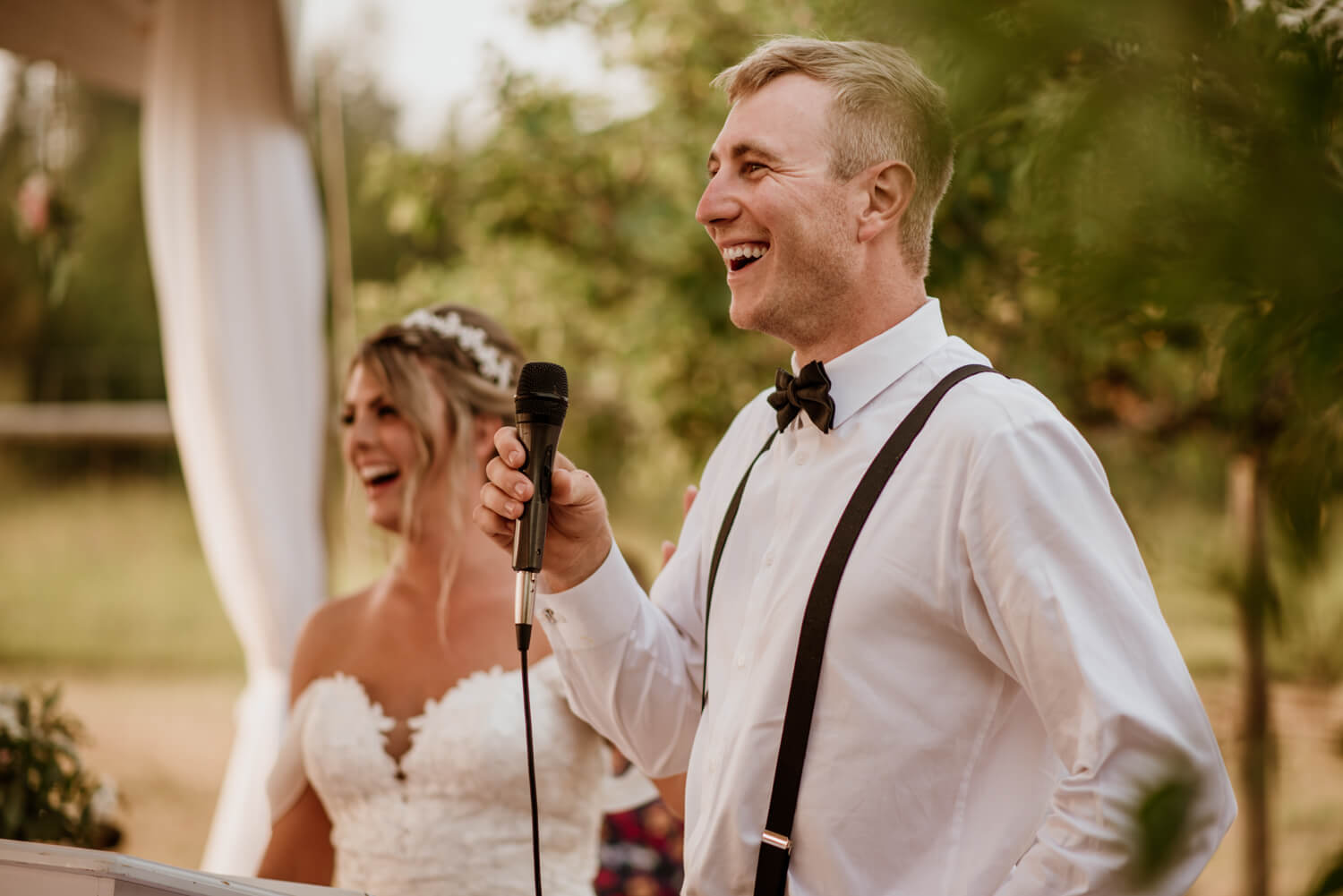 groom gives a speech during his wedding reception