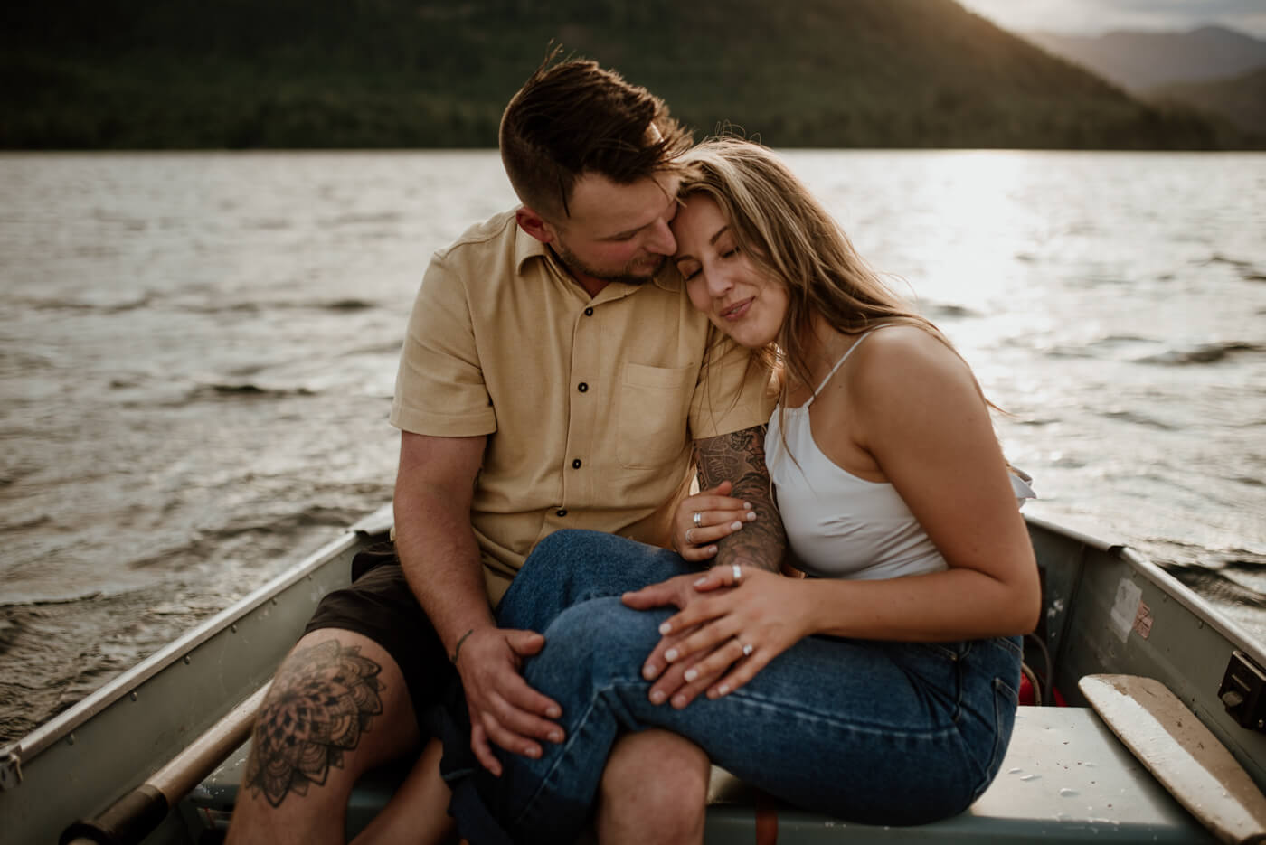 bride and groom snuggle up on their boat