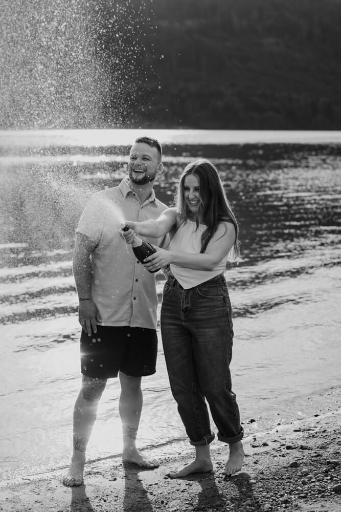 champagne pop photo with bride and groom