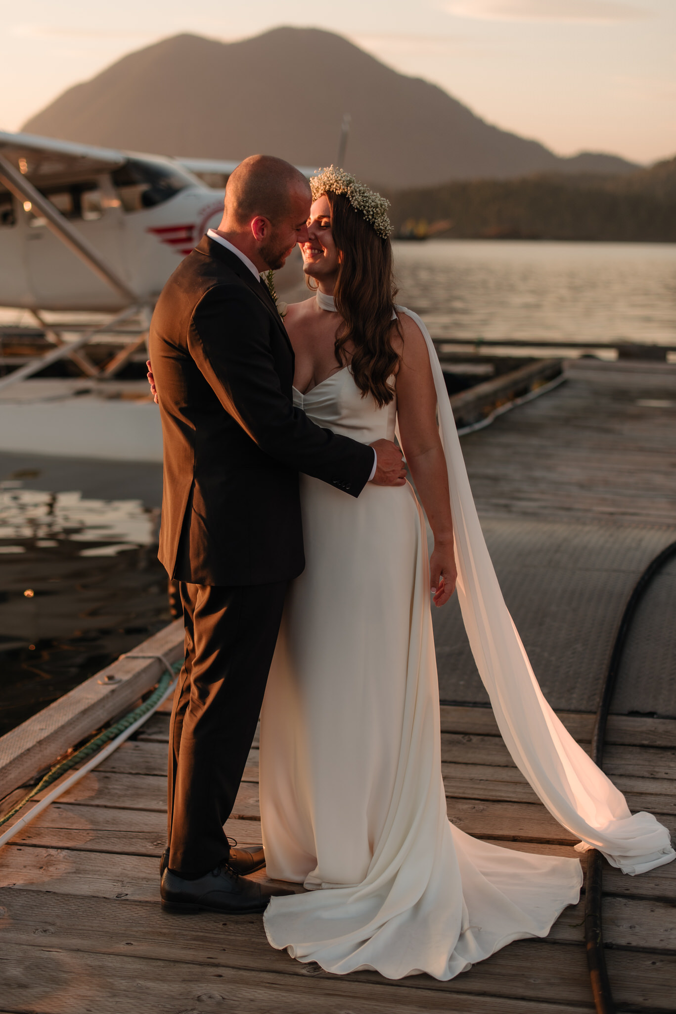 The bride and groom on the docks downtown Tofino for sunset portraits