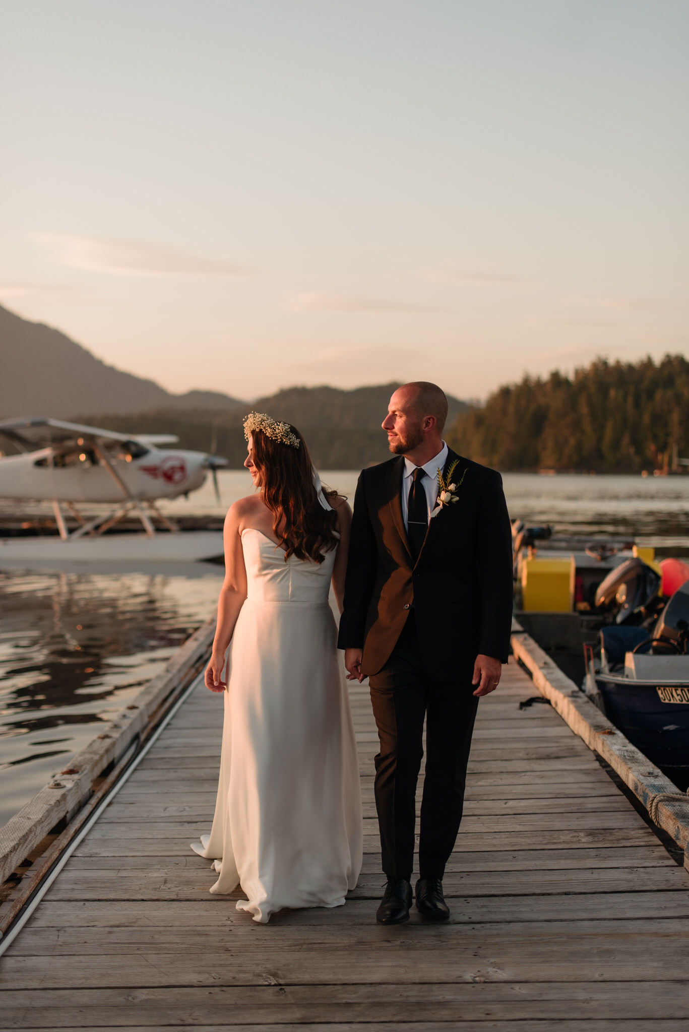 The bride and groom on the docks downtown Tofino for sunset portraits