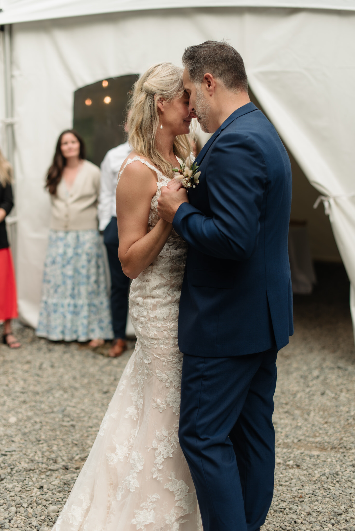 The bride and groom's first dance outside the reception tent at Pacific Sands in Tofino